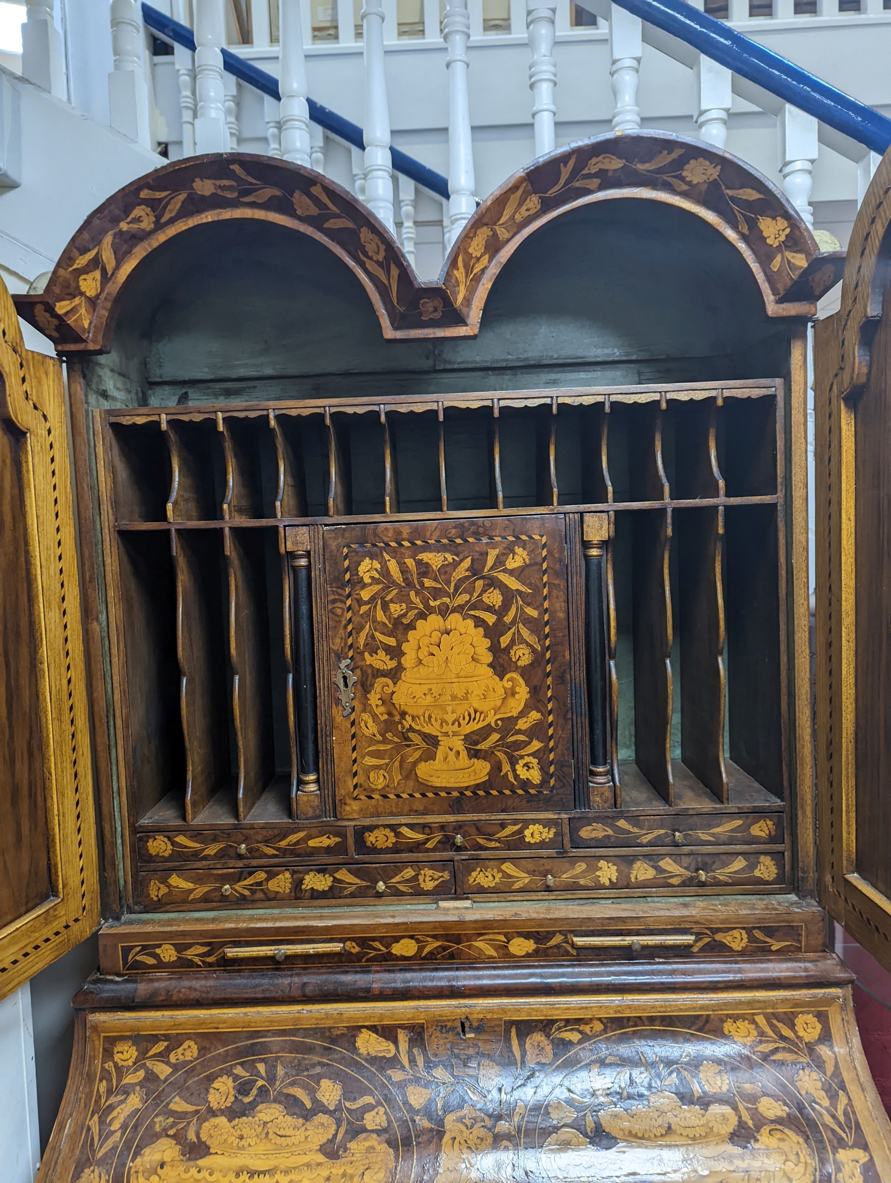 A Dutch floral marquetry walnut bombe bureau cabinet, width 120cm, depth 60cm, height 210cm